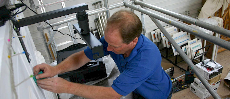 technician installing wiring to connect a tv to your network