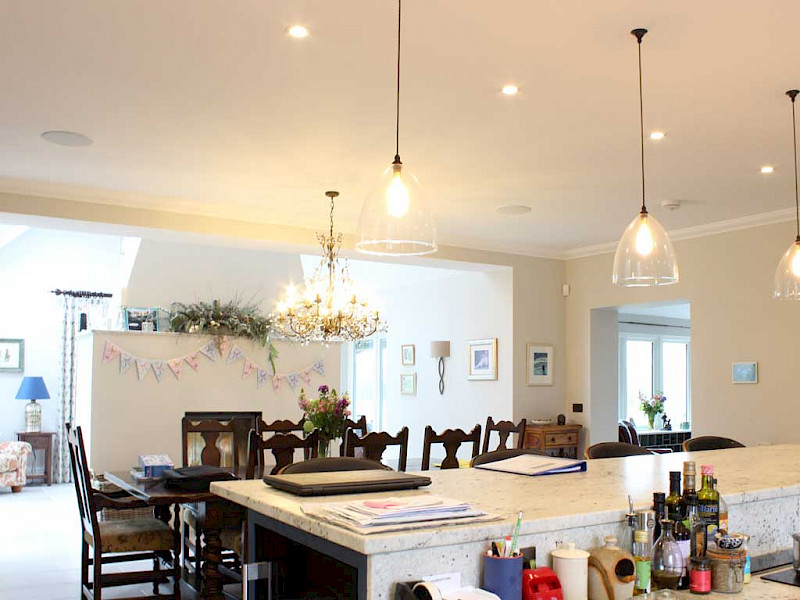 dinning room with smart lighting and in-ceiling lights