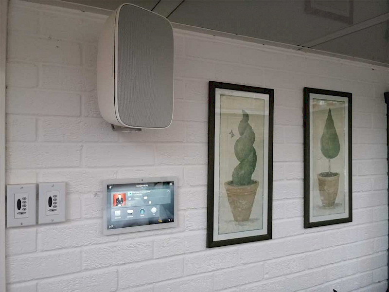 on wall touch screen controller with outside smart speaker