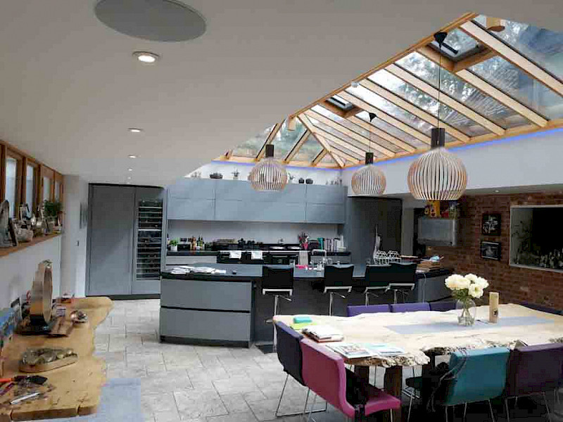 modern kitchen with built in speakers and voice controlled lighting