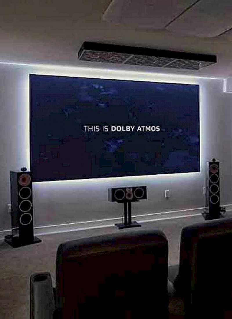 home cinema room with acousticly treated wall covering and cinema seats