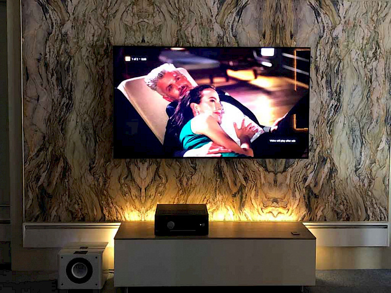 man on ladder fitting Bowers & Wilkins in wall speakers